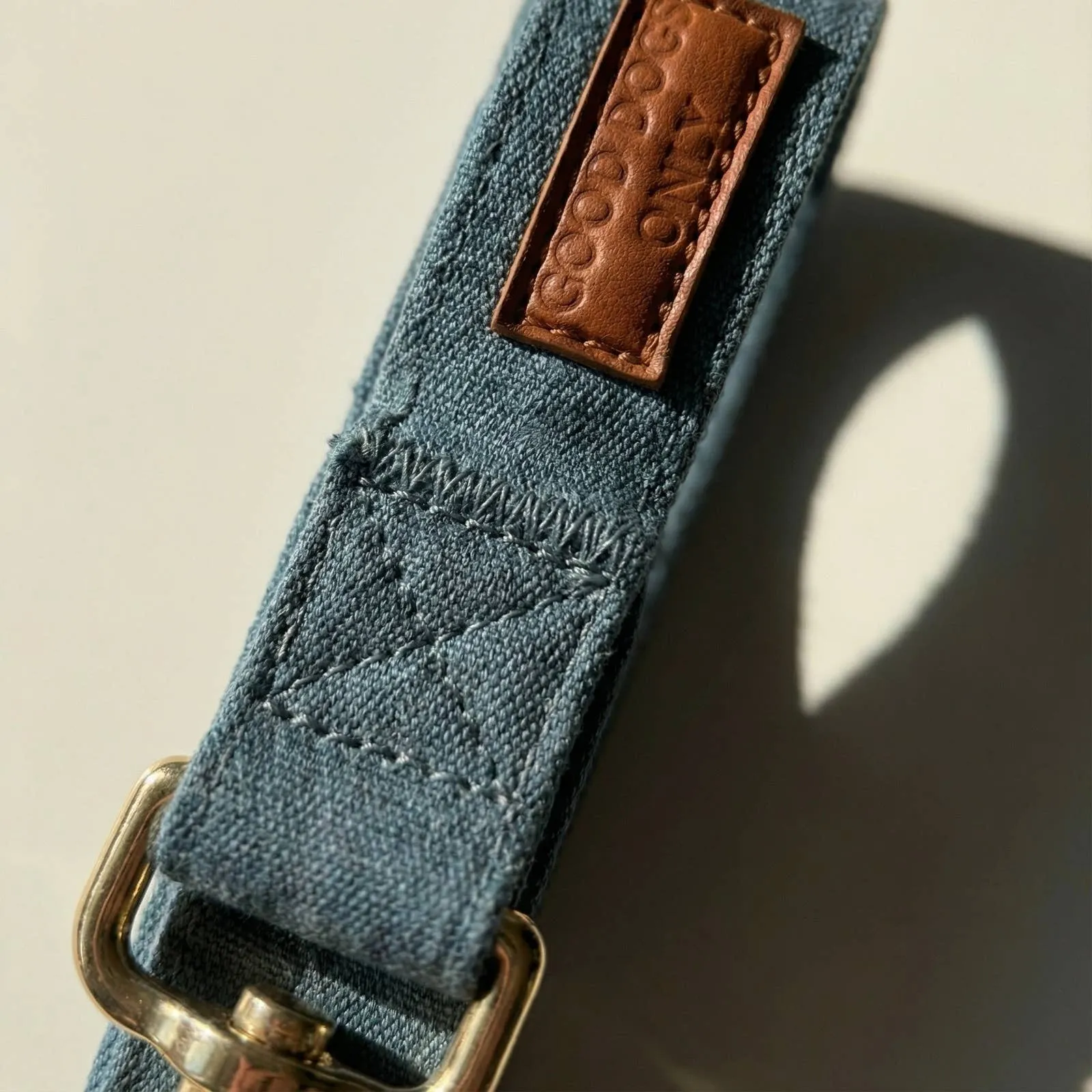 Close-up of the denim and leather tab